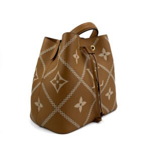 Louis Vuitton NéoNoé MM Bucket Bag in bicolor Empreinte leather with gold-tone hardware.