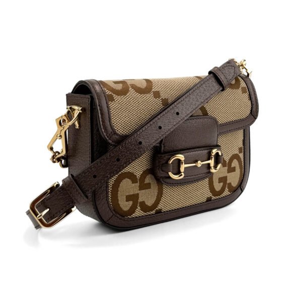 Gucci Horsebit 1955 Mini Shoulder Bag in GG Supreme canvas with brown leather trim and gold-tone Horsebit hardware.